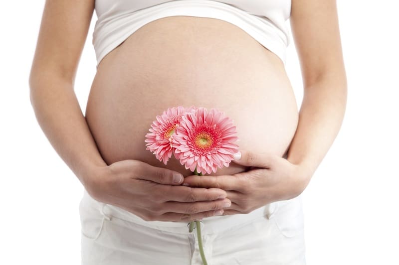 pregnany woman holding flower